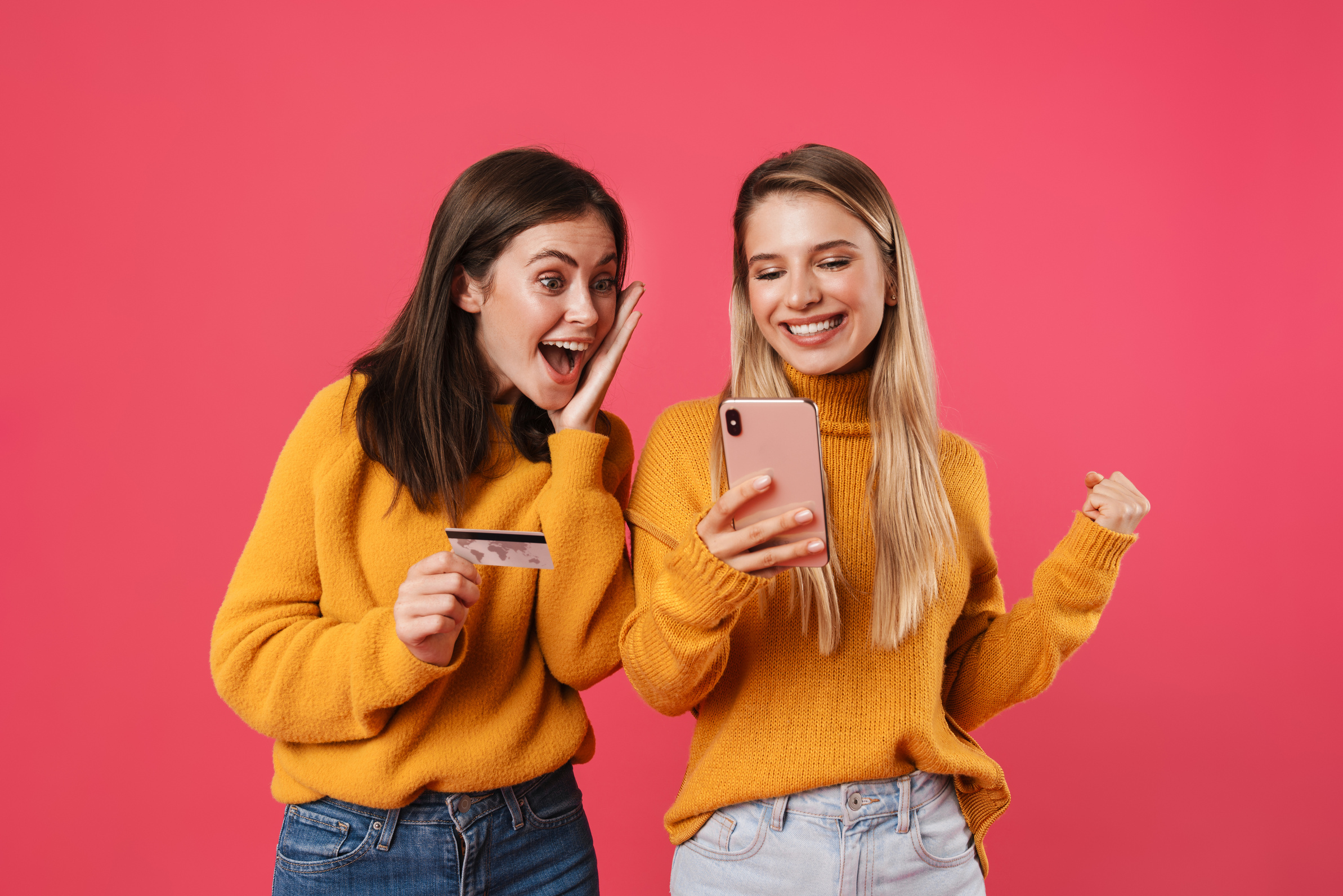 Two Happy Young Girlfriends Shopping Online
